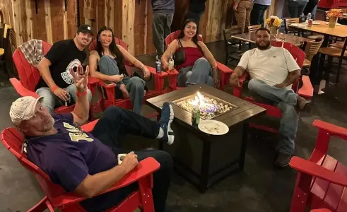 Projected targets and games at axe throwing bar featuring beer and wine in Castle Rock, Washington
